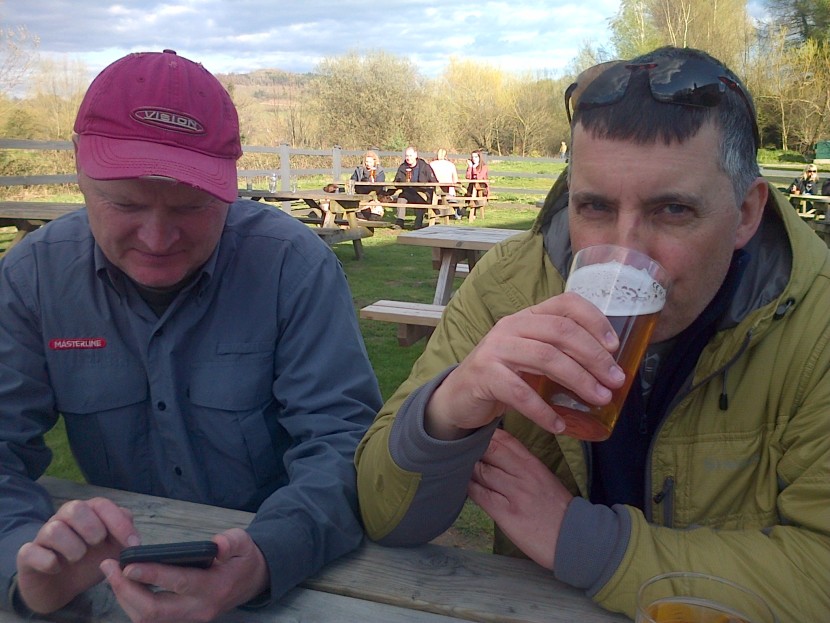 Serious fishing talk by the Bridge Inn, Abergavenny